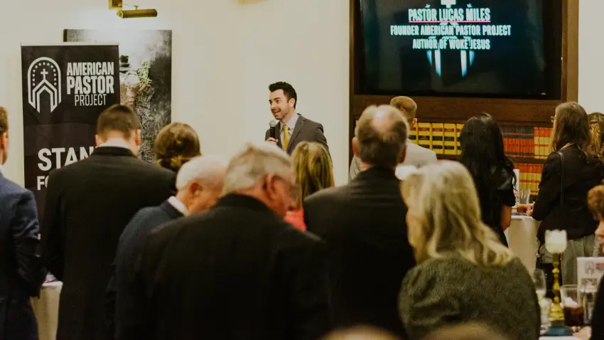 Pastor Lucas Miles speaking before a group of other pastors